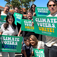People with climate voters unite signs