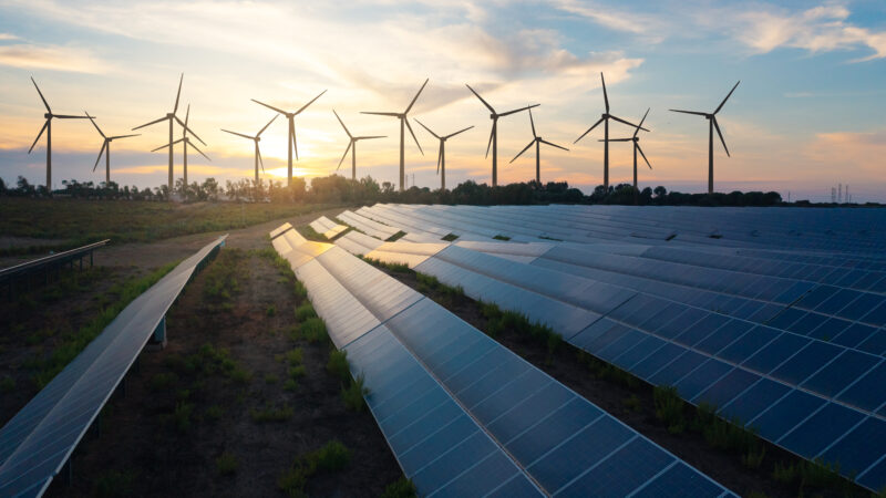 Solar panels and wind turbines generating renewable energy for green and sustainable future.
